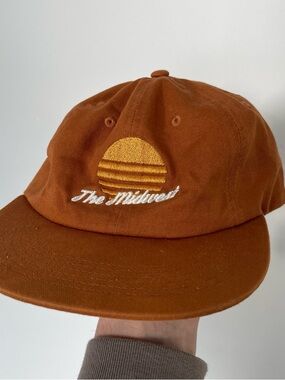 Rust Orange Embroidered Baseball Cap with Yellow Sun Logo